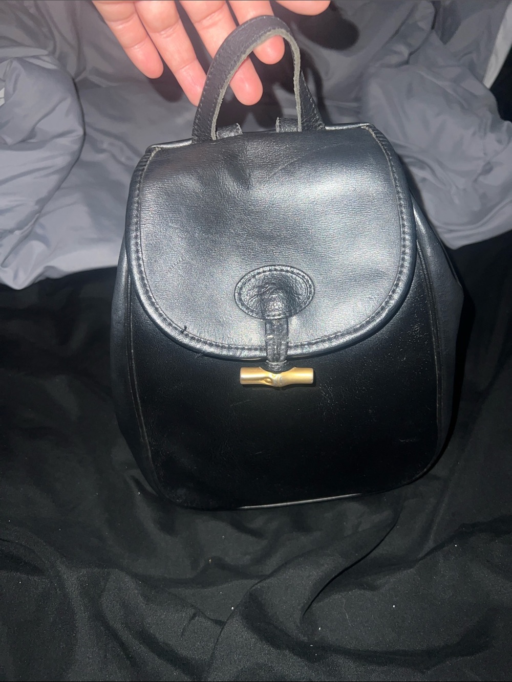 Longchamp Black Leather Mini Backpack with Gold Accent